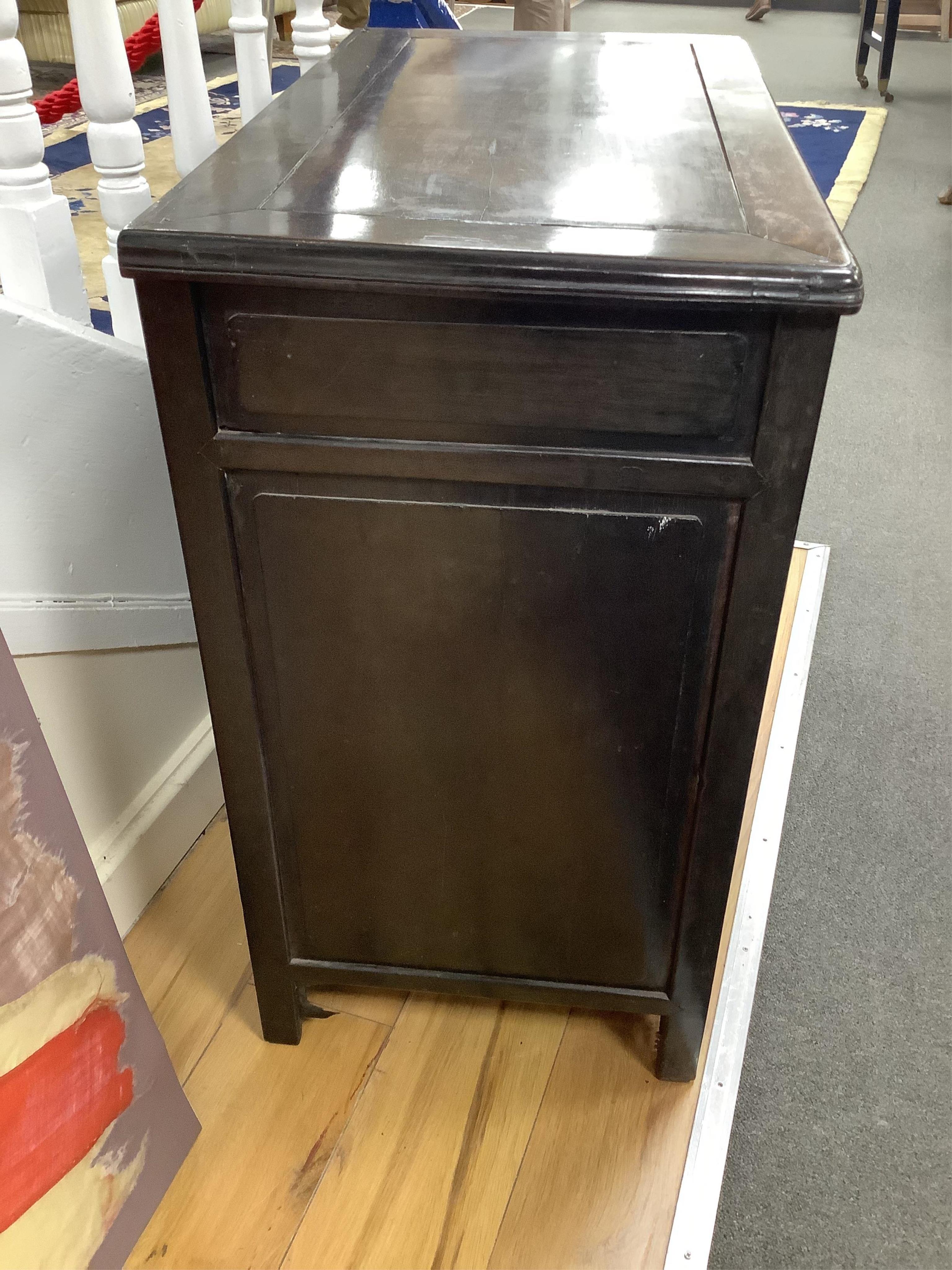 A Chinese hardwood low cabinet, width 77cm, depth 42cm, height 77cm. Condition - fair